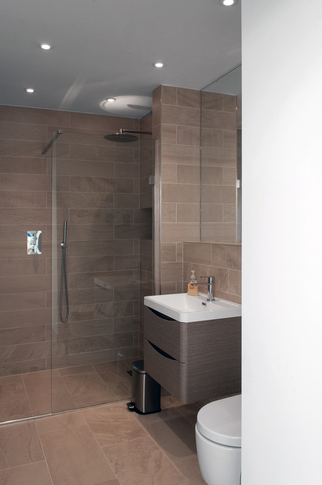 Photo of a mid-sized modern master bathroom in London with flat-panel cabinets, dark wood cabinets, an open shower, beige tile, ceramic tile, brown walls, ceramic floors and brown floor.