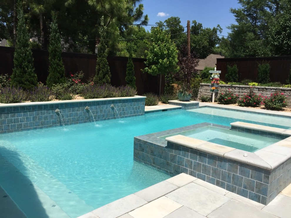 Inspiration for a large transitional backyard concrete paver and rectangular hot tub remodel