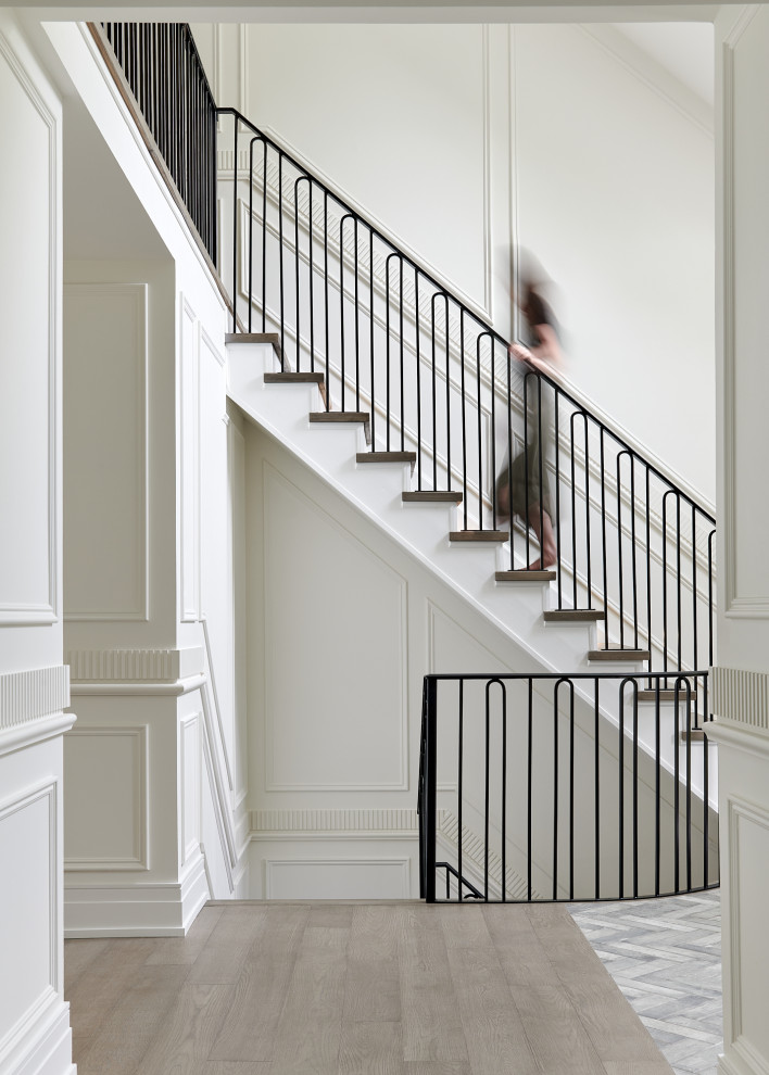 This is an example of a traditional staircase in Toronto with a dado rail.