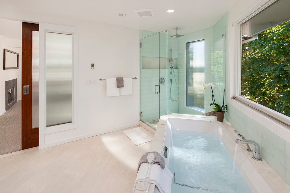 Large asian master bathroom in Seattle with flat-panel cabinets, medium wood cabinets, an undermount tub, a corner shower, white tile, ceramic tile, white walls, porcelain floors, an undermount sink and marble benchtops.