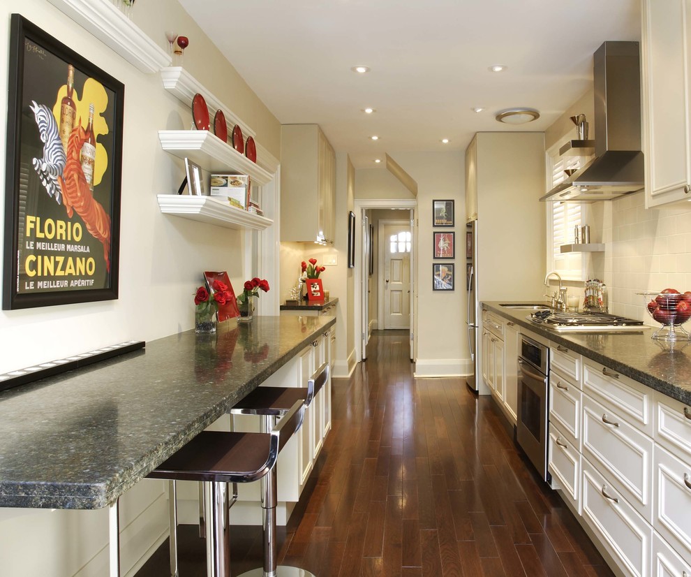 Eat-in kitchen - small transitional galley medium tone wood floor eat-in kitchen idea in Toronto with an undermount sink, raised-panel cabinets, beige cabinets, granite countertops, beige backsplash, porcelain backsplash, stainless steel appliances and no island