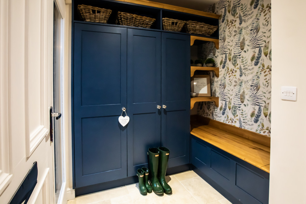 Design ideas for a medium sized rural cloakroom in West Midlands with a wall mounted toilet, beige walls, light hardwood flooring, a wall-mounted sink, beige floors and a feature wall.