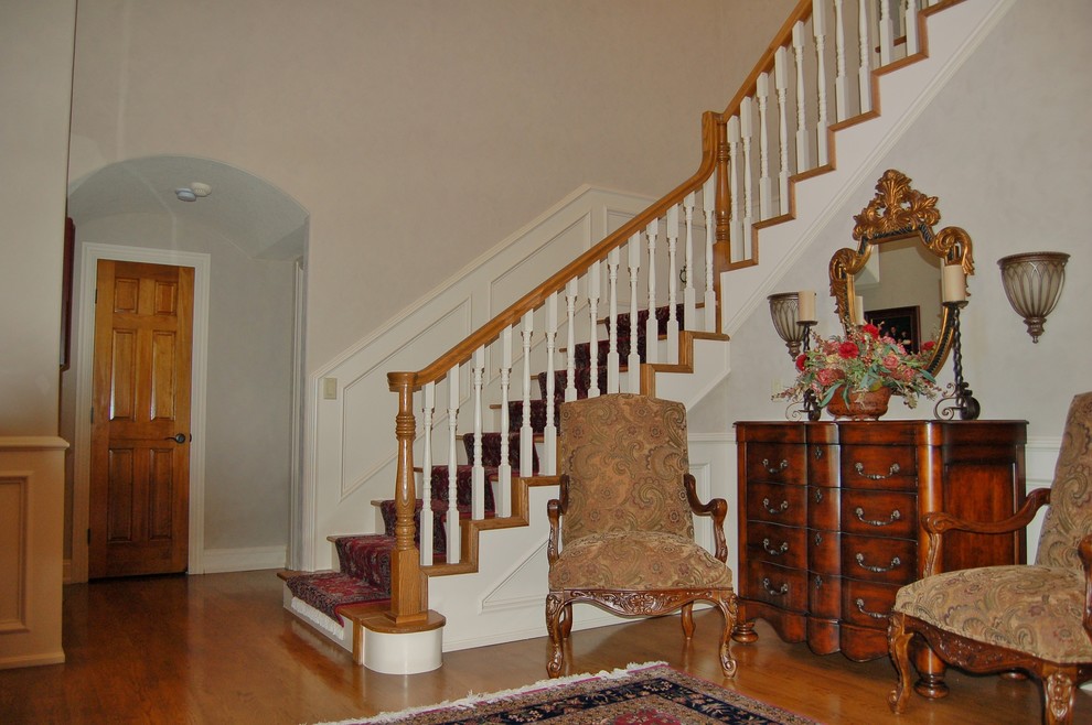 This is an example of a large traditional foyer in Other with white walls.