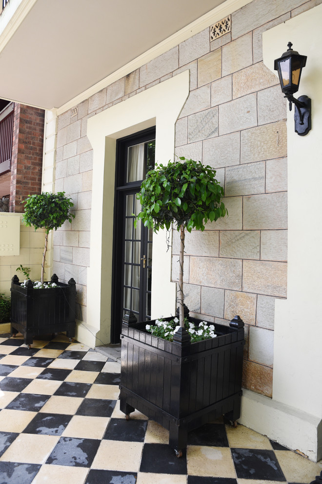 Inspiration for a small traditional courtyard partial sun formal garden in Adelaide with a vertical garden and concrete pavers.
