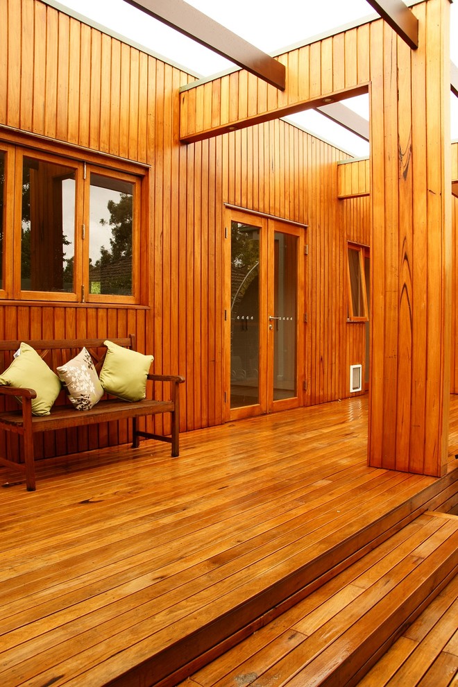 This is an example of a mid-sized contemporary backyard deck in Melbourne with no cover.