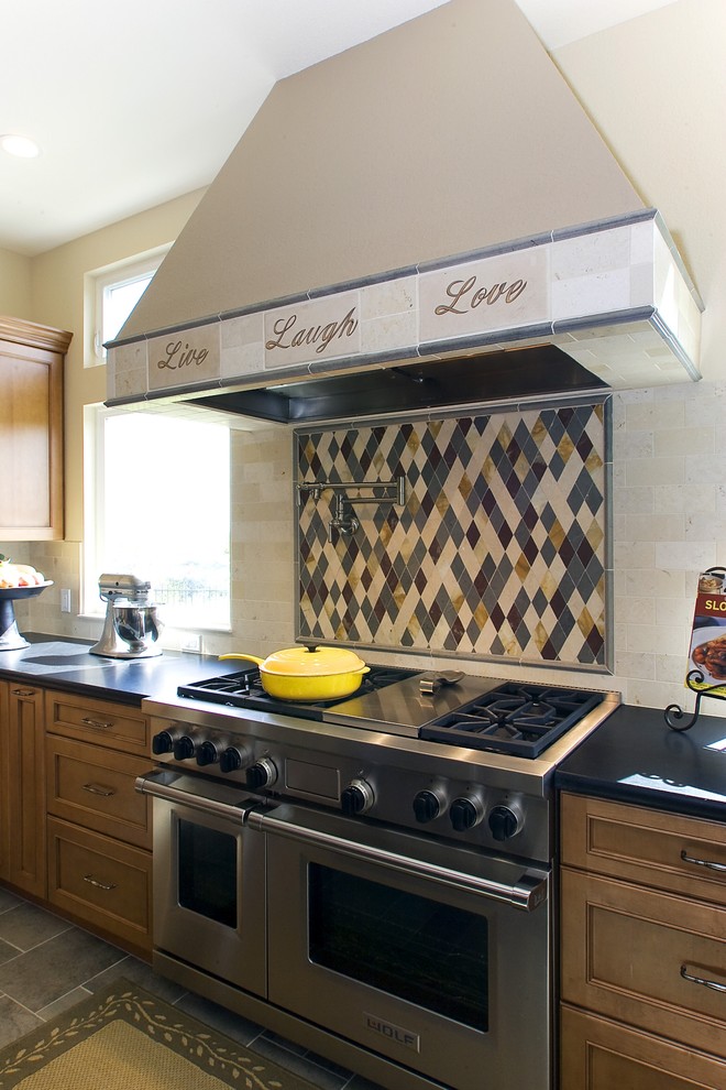 Traditional kitchen in Other with stainless steel appliances.