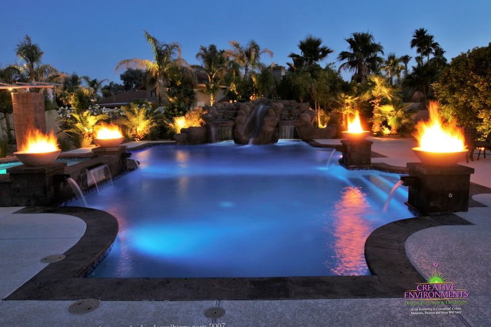 Inspiration for a large backyard stamped concrete and custom-shaped hot tub remodel in Phoenix