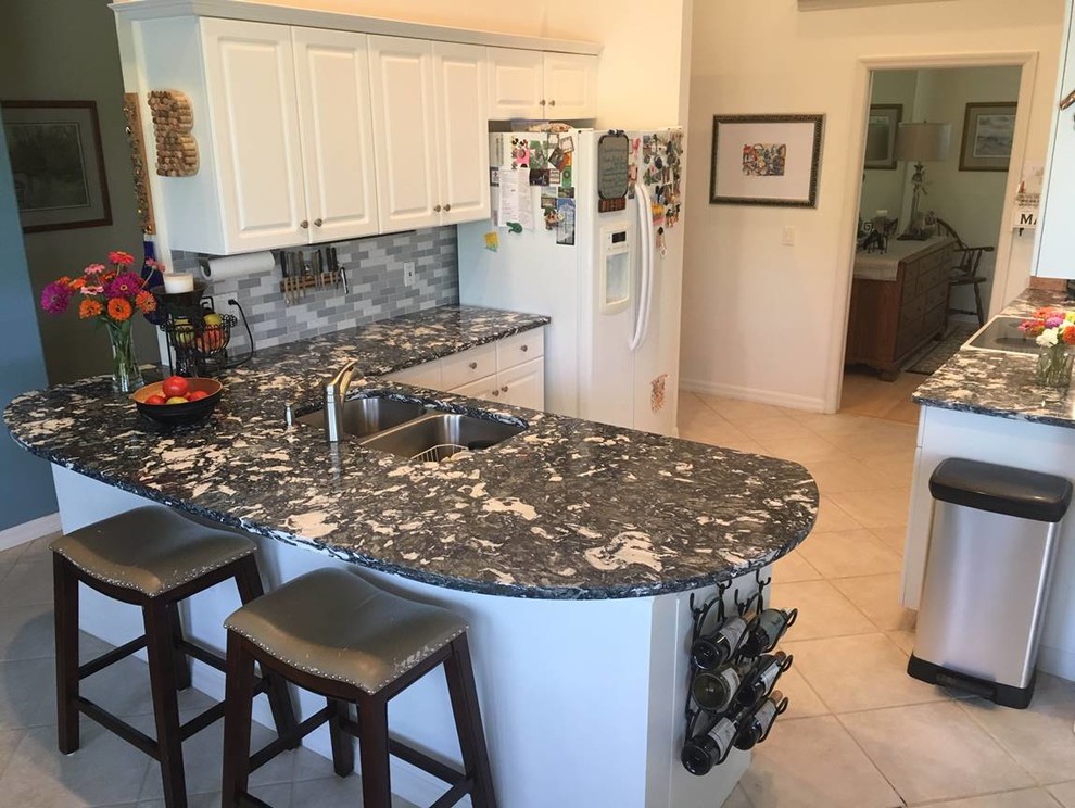 Inspiration for a transitional eat-in kitchen in Tampa with granite benchtops and multi-coloured benchtop.