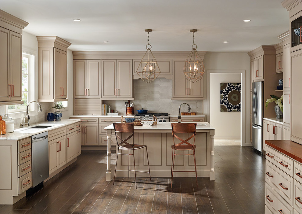 Inspiration for a large transitional l-shaped dark wood floor open concept kitchen remodel in Philadelphia with a single-bowl sink, raised-panel cabinets, beige cabinets, granite countertops, white backsplash, stainless steel appliances and an island