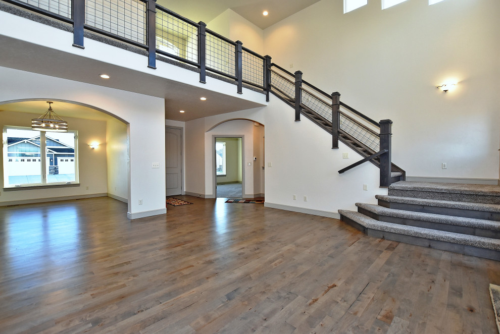 Example of a transitional home design design in Denver
