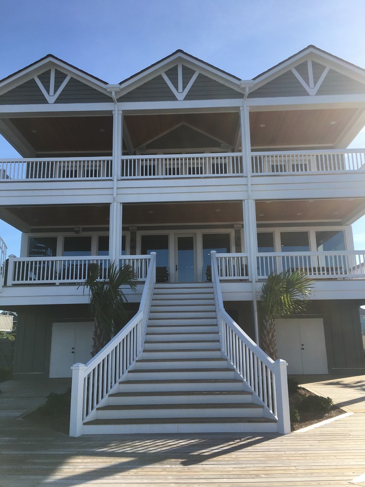 Large transitional two-story wood gray home design photo