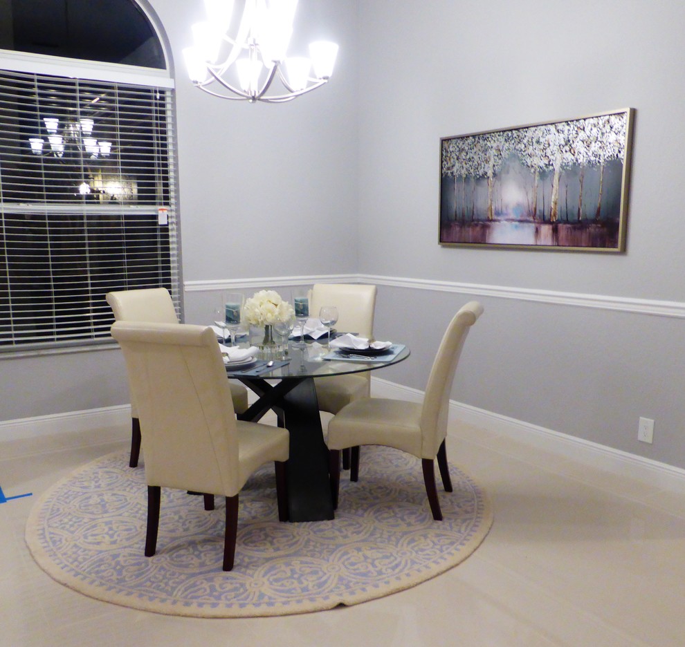 Transitional dining room in Miami with grey walls, ceramic floors and no fireplace.