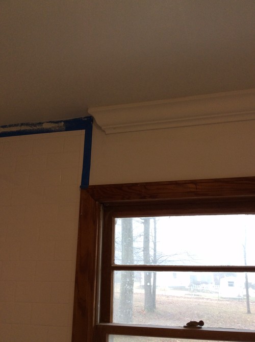 Crown molding transitions against tile shower