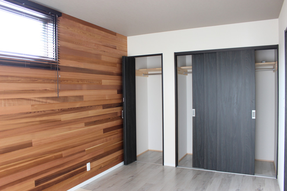 他の地域にあるおしゃれなファミリールームの写真