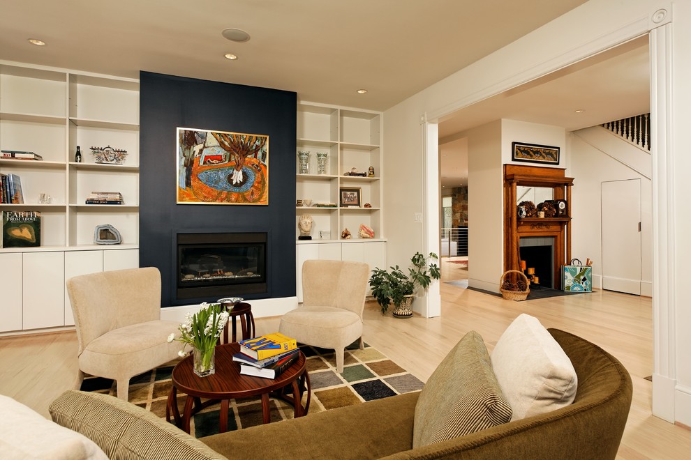 Inspiration for a mid-sized transitional formal enclosed living room in DC Metro with a standard fireplace, no tv, white walls, light hardwood floors, a metal fireplace surround and beige floor.