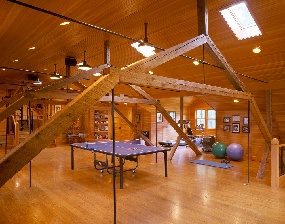Huge farmhouse medium tone wood floor multiuse home gym photo in Boston