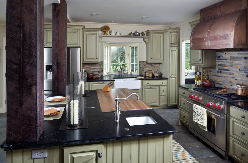 Kitchen - transitional kitchen idea in Indianapolis with a drop-in sink, green cabinets, multicolored backsplash, stainless steel appliances and an island