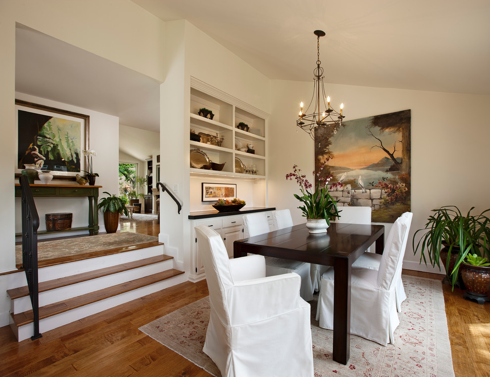 Photo of a traditional dining room in Santa Barbara with white walls and dark hardwood floors.