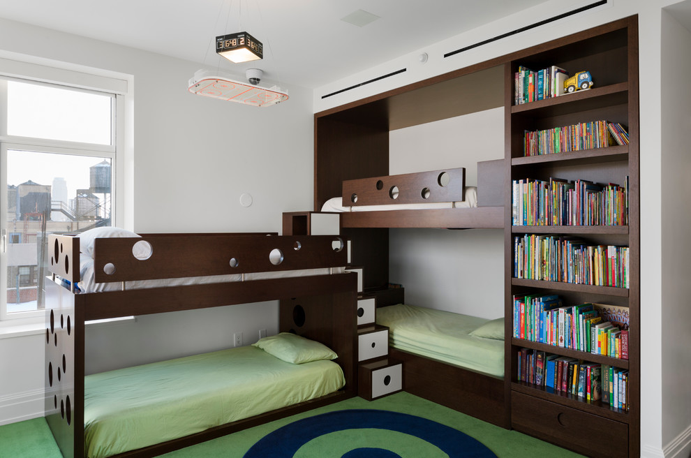 Design ideas for a mid-sized contemporary kids' bedroom for kids 4-10 years old and boys in New York with white walls, dark hardwood floors and brown floor.