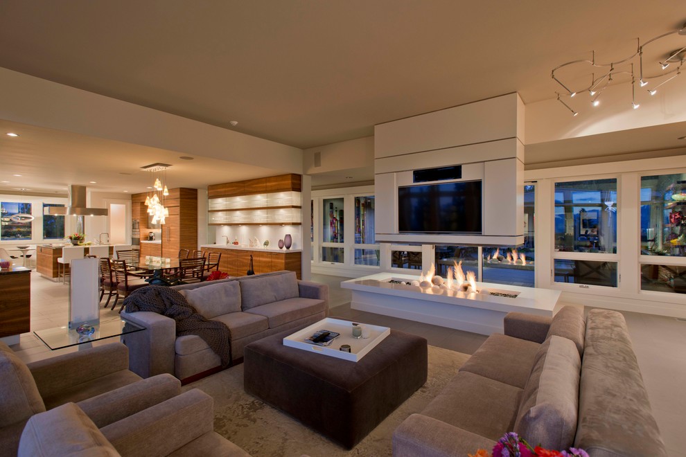 Photo of a contemporary open concept living room in Other with beige walls and a wall-mounted tv.