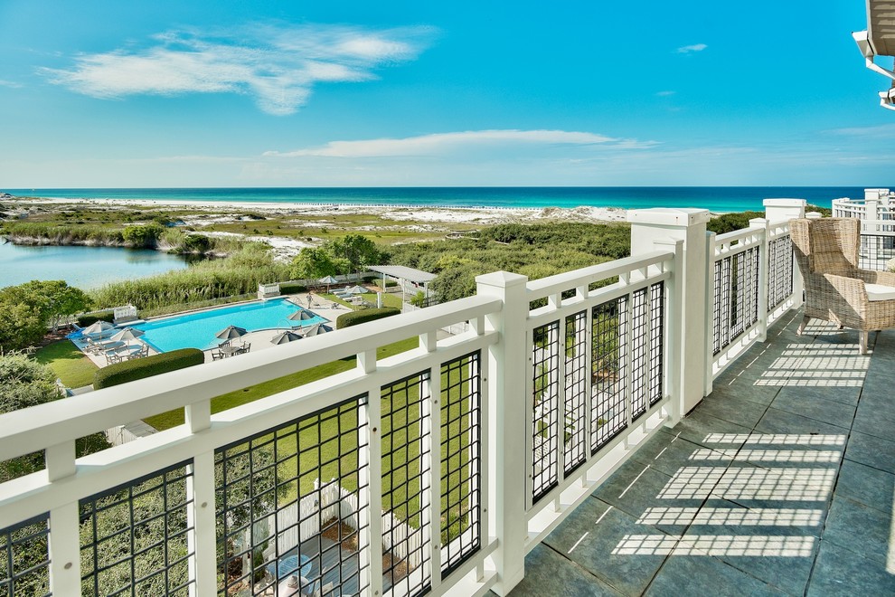 Photo of a beach style deck in Miami.