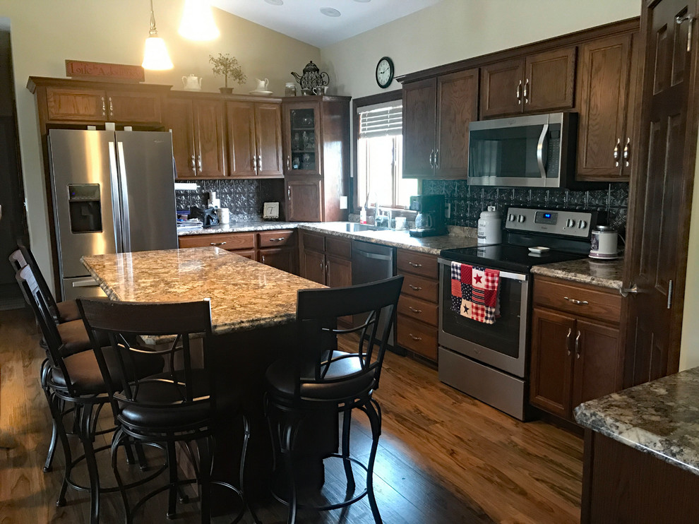 Inspiration for a brown floor kitchen remodel with brown cabinets, brown backsplash, an island and brown countertops