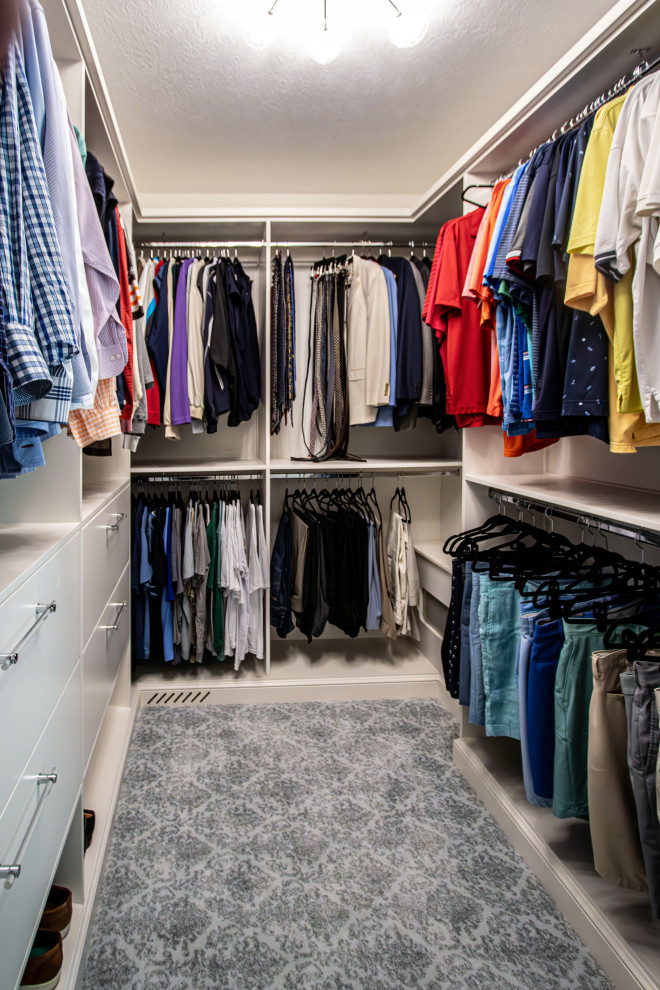 Design ideas for a medium sized classic walk-in wardrobe for men in Cleveland with flat-panel cabinets, white cabinets, carpet and grey floors.
