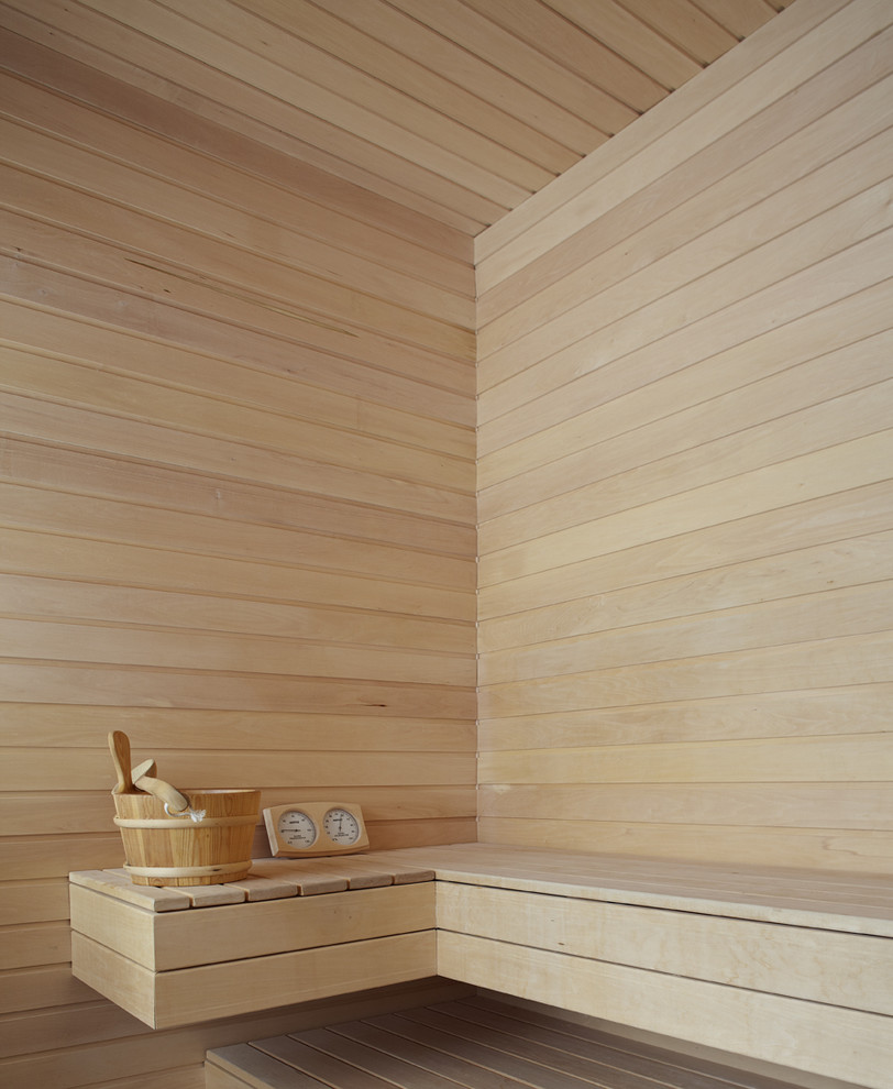 Inspiration for a large contemporary bathroom in Toronto with beige walls and light hardwood floors.