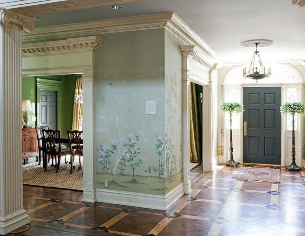 This is an example of a mid-sized traditional hallway in Nashville with green walls and medium hardwood floors.