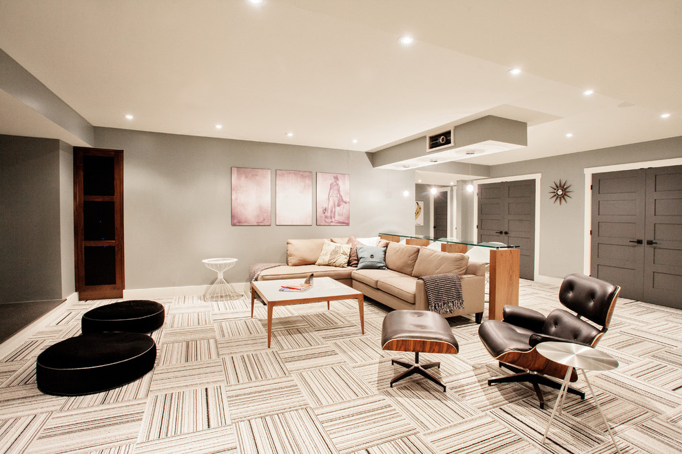 Contemporary basement in Toronto with multi-coloured floor.