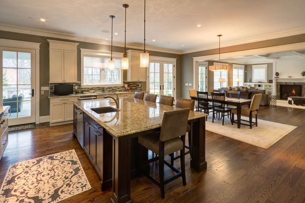 Open concept kitchen - transitional u-shaped medium tone wood floor open concept kitchen idea in DC Metro with an undermount sink, beaded inset cabinets, white cabinets, granite countertops, gray backsplash, matchstick tile backsplash, stainless steel appliances and an island