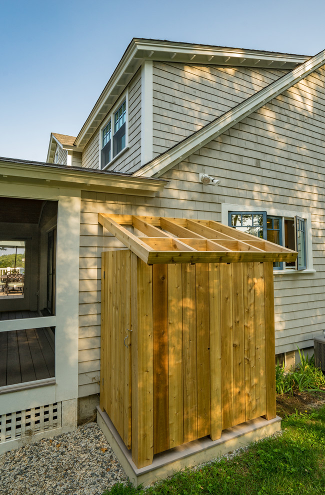 Photo of a mid-sized traditional backyard deck in Boston with an outdoor shower and a roof extension.