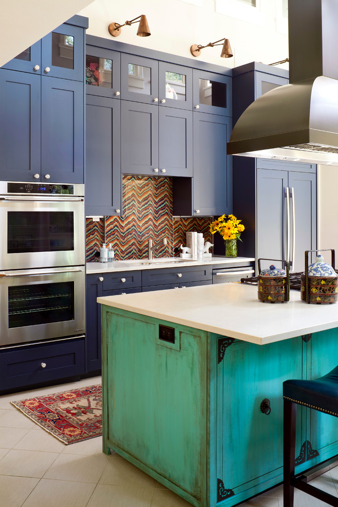 Eclectic kitchen in Denver with an undermount sink, shaker cabinets, blue cabinets, multi-coloured splashback, stainless steel appliances and with island.