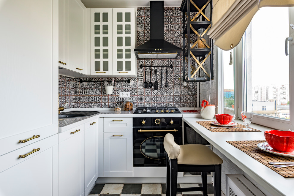 Kitchen - u-shaped multicolored floor kitchen idea in Moscow with shaker cabinets, white cabinets, multicolored backsplash, black appliances and no island