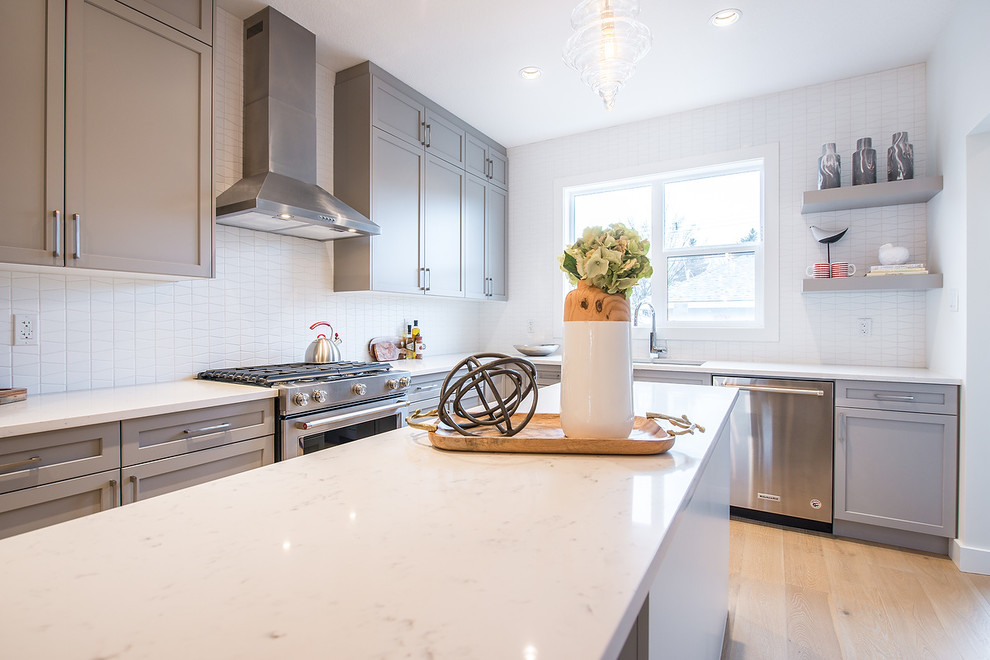 Example of a transitional kitchen design in Edmonton