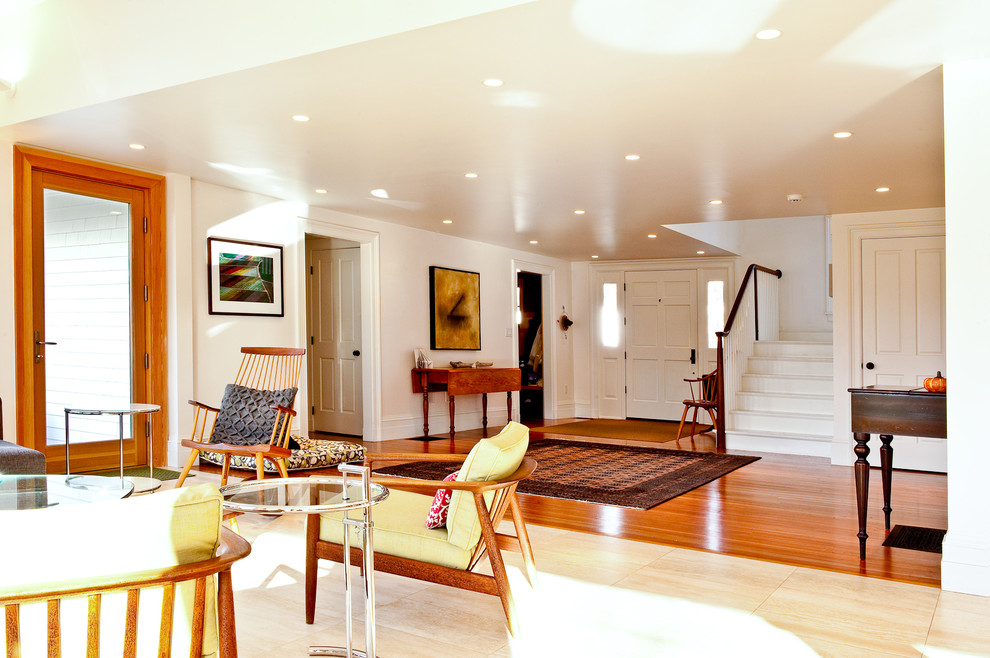 Photo of a traditional living room in Boston with white walls.
