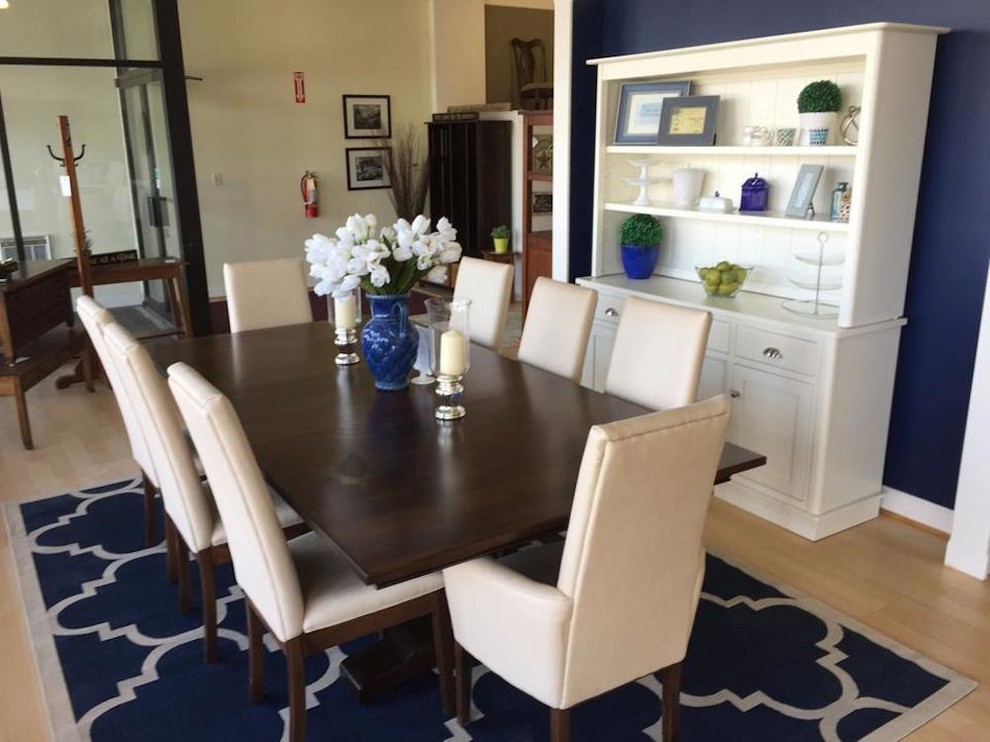Design ideas for a mid-sized transitional separate dining room in Detroit with blue walls and light hardwood floors.