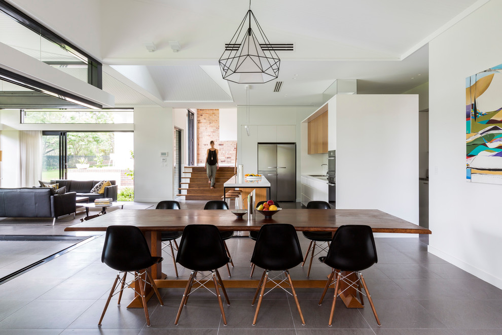 Photo of a contemporary open plan dining in Sydney with white walls and no fireplace.