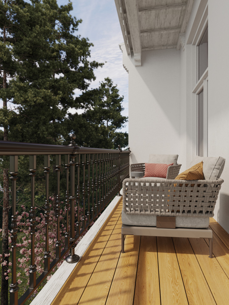Aménagement d'un petit balcon classique d'appartement avec une extension de toiture et un garde-corps en métal.