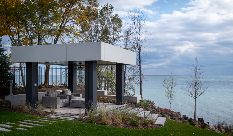 Inspiration for a large contemporary patio in Toronto with a gazebo/cabana.