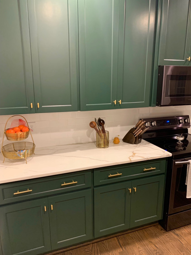 Dark Green Cabinets Add Elegance to a Welcoming Kitchen