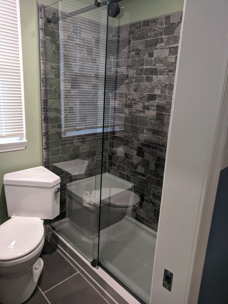 Inspiration for a small modern master bathroom in Wilmington with grey cabinets, an alcove shower, slate floors, engineered quartz benchtops, black floor, a sliding shower screen, white benchtops, a double vanity and a freestanding vanity.