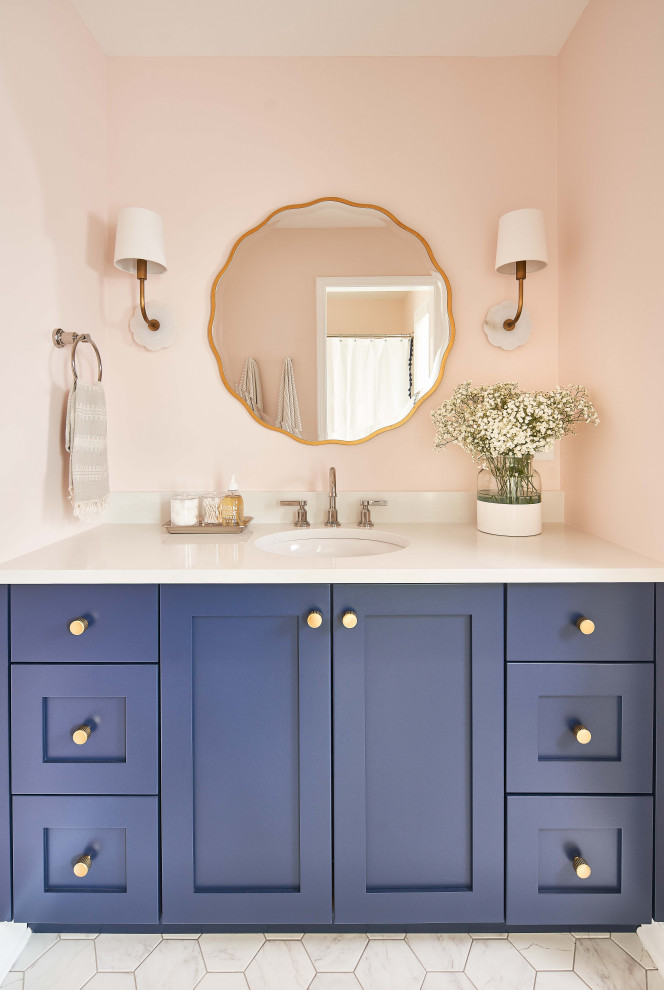 This is an example of a mid-sized beach style kids bathroom in Charlotte with shaker cabinets, blue cabinets, pink walls, porcelain floors, an undermount sink, engineered quartz benchtops, white floor, white benchtops, a single vanity and a built-in vanity.