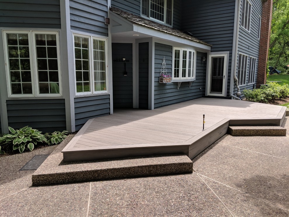 Inspiration for a mid-sized coastal backyard deck remodel with no cover