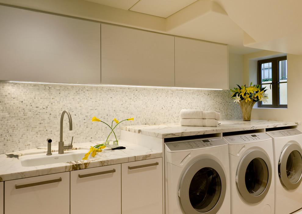 Inspiration for a contemporary laundry room in Los Angeles with an undermount sink and white benchtop.