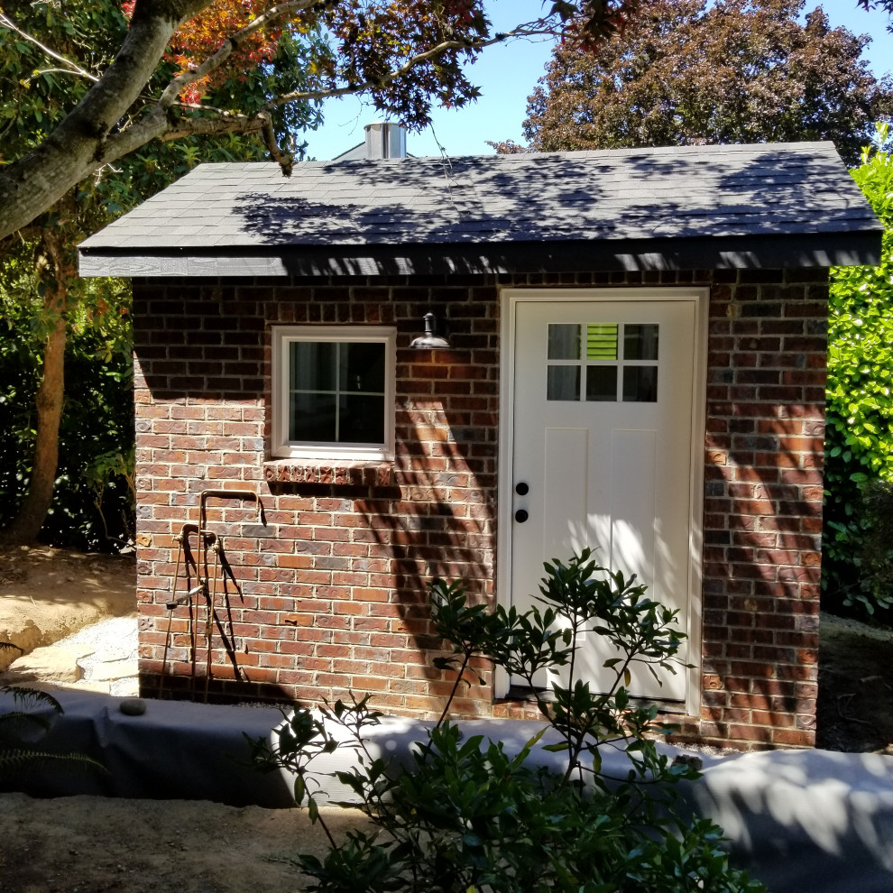 Inspiration for a small rustic backyard brick and custom-shaped pool house remodel in Portland