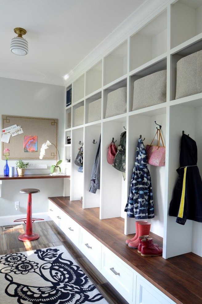 Photo of a mid-sized traditional mudroom in Portland with white walls.