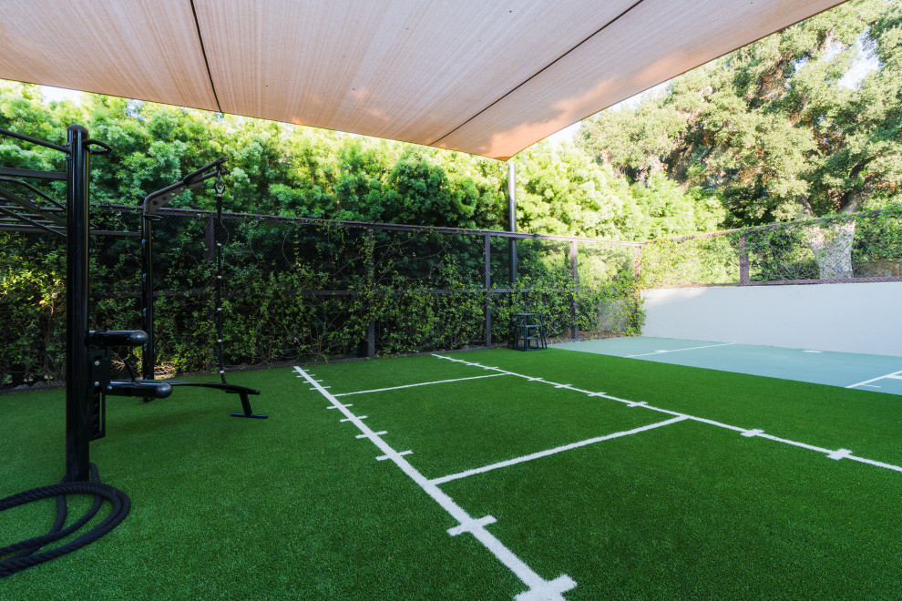 This is an example of a mid-sized multipurpose gym in Santa Barbara with green floor.