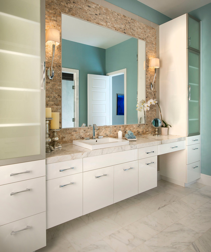 Large contemporary master bathroom in Dallas with a drop-in sink, flat-panel cabinets, white cabinets, marble benchtops, a drop-in tub, a double shower, a two-piece toilet, stone slab, blue walls, marble floors, white tile and black and white tile.