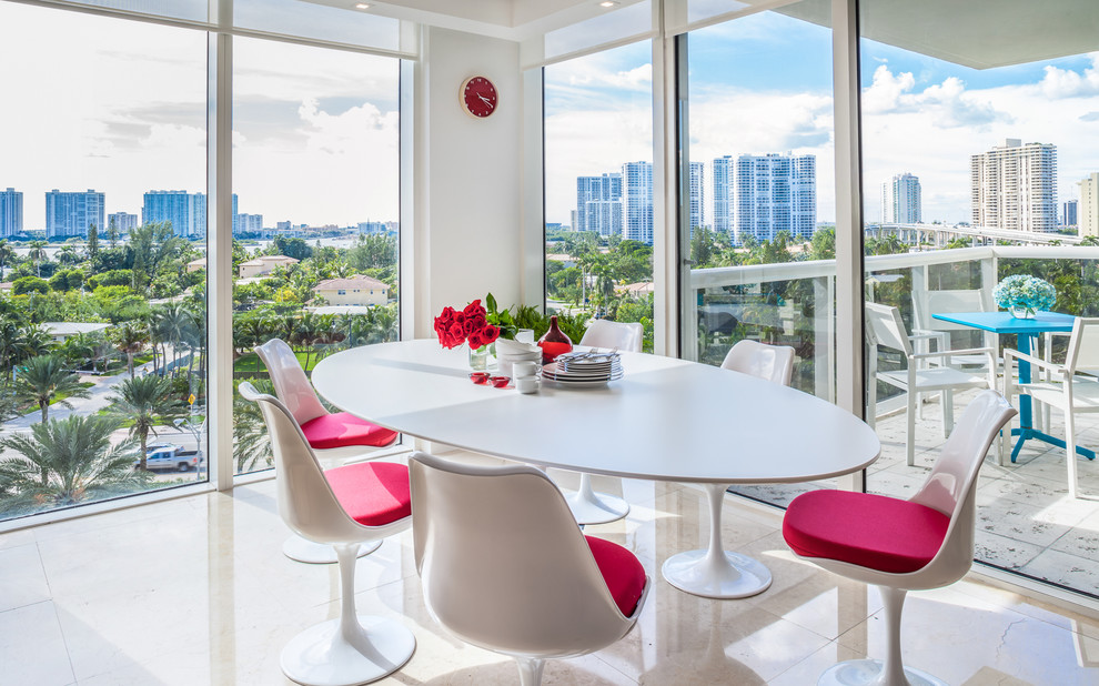 Example of a trendy dining room design in Miami with white walls